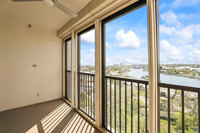 10355 Paradise Blvd Unit 1003, Treasure Island, FL 33706 - unfurnished sunroom with a water view and plenty of natural light