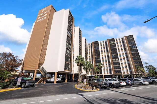 10355 Paradise Blvd Unit 1003, Treasure Island, FL 33706 - view of property featuring uncovered parking