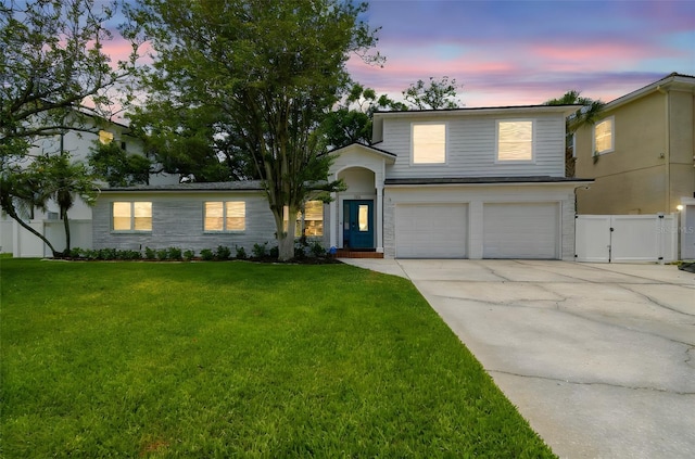 5005 W Evelyn Dr, Tampa, FL 33609 - view of front of property with a garage, driveway, and a gate