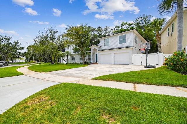 5005 W Evelyn Dr, Tampa, FL 33609 - view of front of house featuring a garage, a gate, and concrete driveway