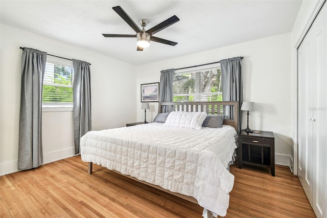 5005 W Evelyn Dr, Tampa, FL 33609 - bedroom featuring a closet, wood finished floors, baseboards, and a ceiling fan