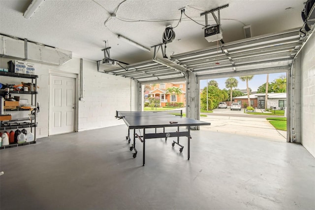 5005 W Evelyn Dr, Tampa, FL 33609 - garage with a garage door opener and concrete block wall