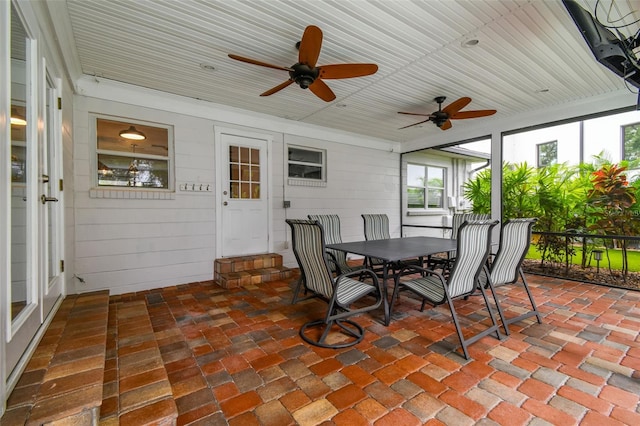 5005 W Evelyn Dr, Tampa, FL 33609 - sunroom / solarium with a ceiling fan and outdoor dining space
