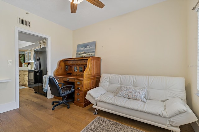 1586 Gulf Blvd Unit 2502, Clearwater, FL 33767 - office space with wood finished floors, ceiling fan, and baseboards