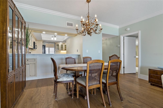 1586 Gulf Blvd Unit 2502, Clearwater, FL 33767 - dining area with ornamental molding, dark wood-style flooring, a chandelier, and baseboards