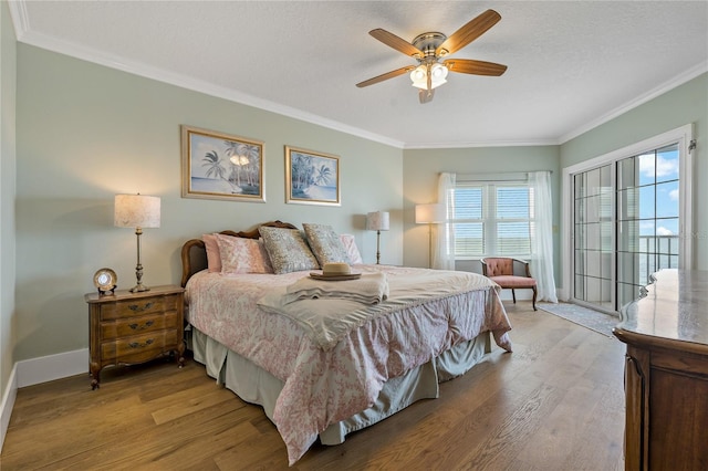 1586 Gulf Blvd Unit 2502, Clearwater, FL 33767 - bedroom featuring crown molding, light wood-style flooring, baseboards, a ceiling fan, and a textured ceiling