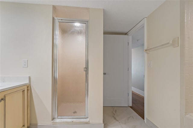 1586 Gulf Blvd Unit 2502, Clearwater, FL 33767 - full bathroom featuring a shower stall, marble finish flooring, vanity, and baseboards