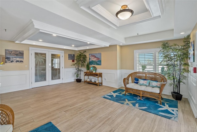 1586 Gulf Blvd Unit 2502, Clearwater, FL 33767 - living area with a raised ceiling, french doors, light wood-style flooring, crown molding, and wainscoting