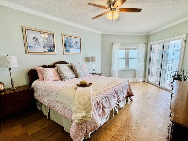 1586 Gulf Blvd Unit 2502, Clearwater, FL 33767 - bedroom featuring wood finished floors, a textured ceiling, ornamental molding, and ceiling fan