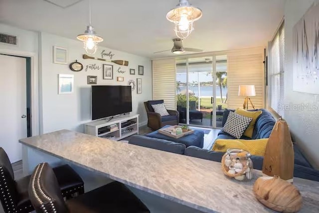 5701 Bahia Del Mar Cir Unit 108, Saint Petersburg, FL 33715 - living area featuring a ceiling fan