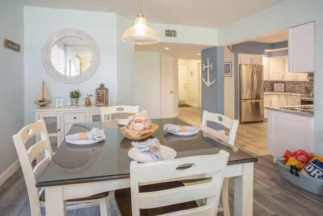 5701 Bahia Del Mar Cir Unit 108, Saint Petersburg, FL 33715 - dining area with light wood-type flooring