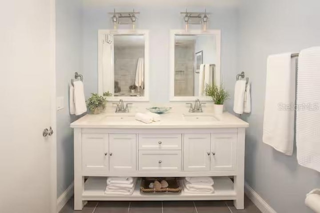 5701 Bahia Del Mar Cir Unit 108, Saint Petersburg, FL 33715 - bathroom with double vanity and baseboards