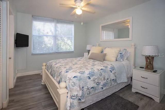 5701 Bahia Del Mar Cir Unit 108, Saint Petersburg, FL 33715 - bedroom featuring dark wood-style floors, baseboards, and ceiling fan
