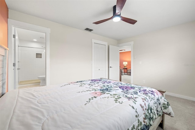2510 Laurelwood Dr Unit 5B, Clearwater, FL 33763 - bedroom with light colored carpet, baseboards, ensuite bath, and ceiling fan