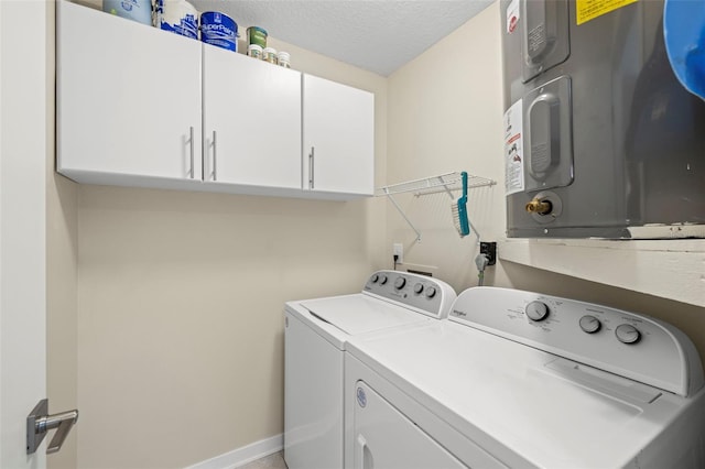 2510 Laurelwood Dr Unit 5B, Clearwater, FL 33763 - laundry area with cabinet space, independent washer and dryer, a textured ceiling, and baseboards