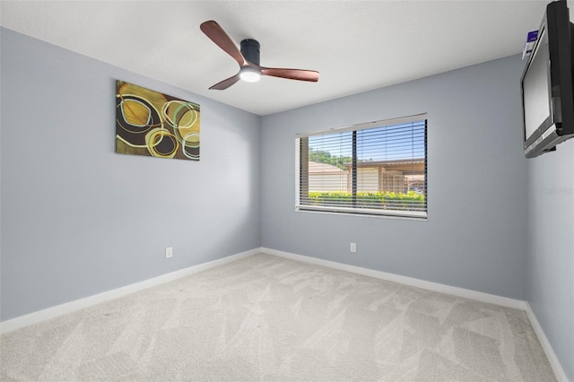 2510 Laurelwood Dr Unit 5B, Clearwater, FL 33763 - empty room with light carpet, baseboards, and ceiling fan