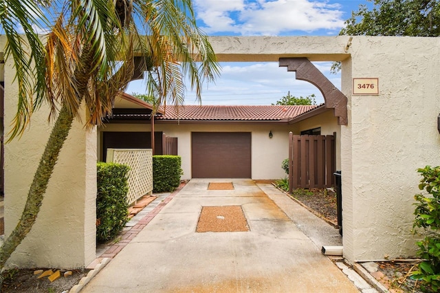 3476 Tarpon Woods Blvd, Palm Harbor, FL 34685 - view of front of property with stucco siding, an attached garage, concrete driveway, and a tile roof