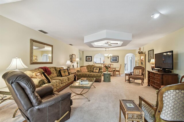 3476 Tarpon Woods Blvd, Palm Harbor, FL 34685 - living area with arched walkways, light colored carpet, and a chandelier
