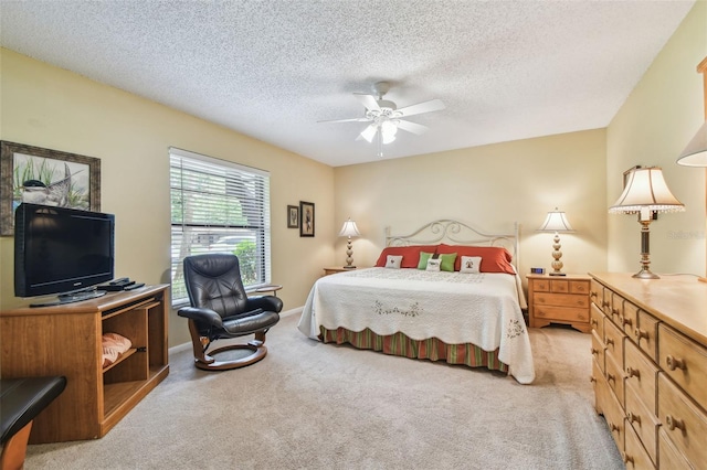 3476 Tarpon Woods Blvd, Palm Harbor, FL 34685 - bedroom with light carpet, a textured ceiling, and a ceiling fan