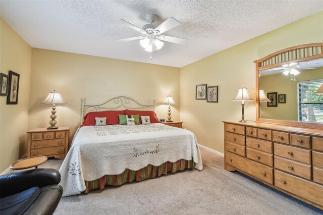 3476 Tarpon Woods Blvd, Palm Harbor, FL 34685 - carpeted bedroom with ceiling fan, a textured ceiling, and baseboards