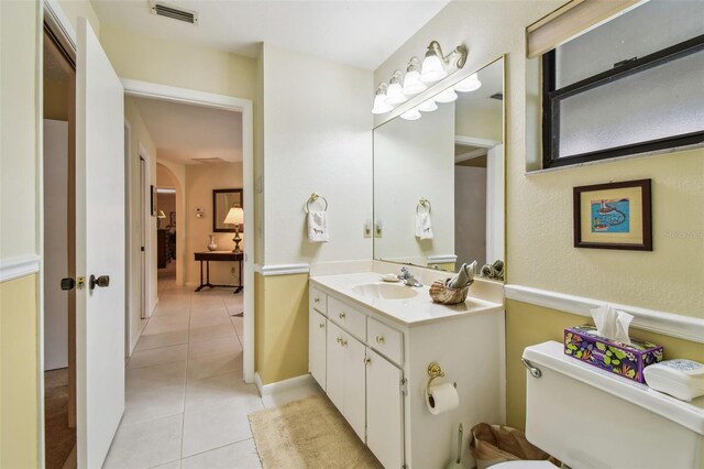 3476 Tarpon Woods Blvd, Palm Harbor, FL 34685 - bathroom with tile patterned flooring, toilet, and vanity