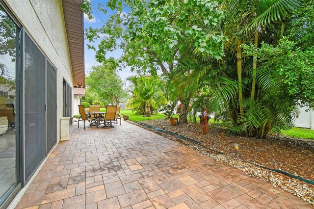 3476 Tarpon Woods Blvd, Palm Harbor, FL 34685 - view of patio featuring outdoor dining space