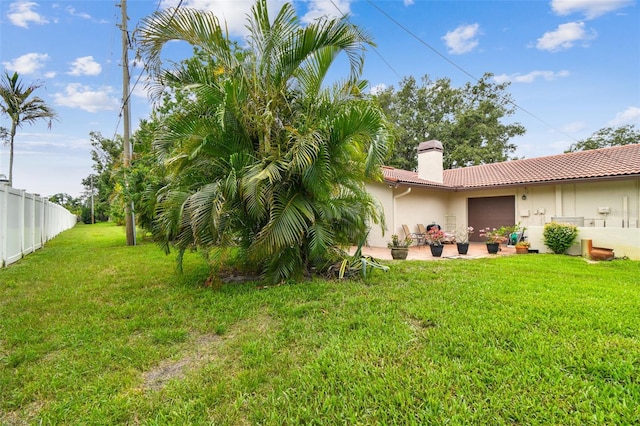 3476 Tarpon Woods Blvd, Palm Harbor, FL 34685 - view of yard with a garage and a patio area