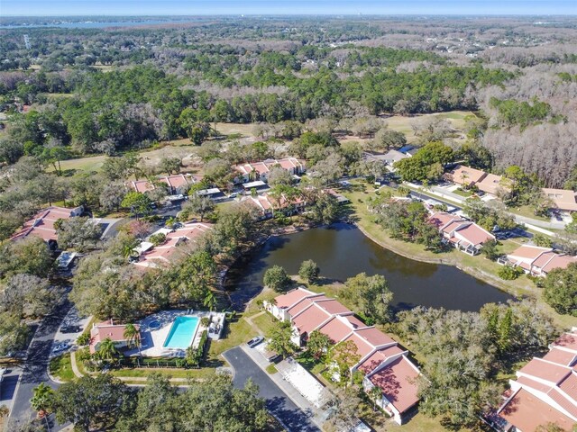 3476 Tarpon Woods Blvd, Palm Harbor, FL 34685 - aerial view of property's location with a forest, a nearby body of water, a pool, and nearby suburban area
