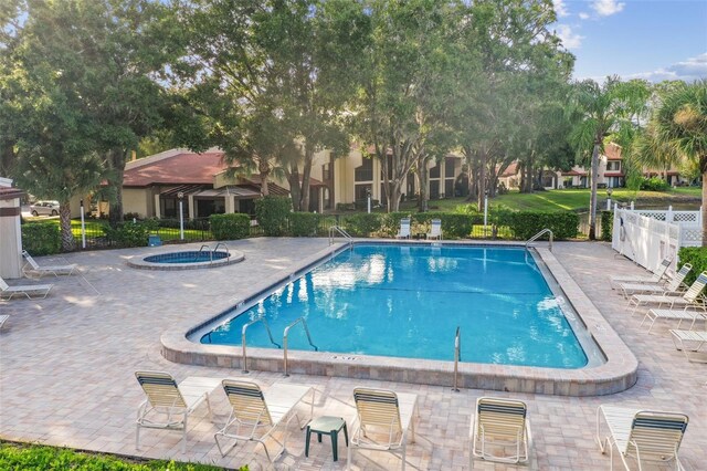 3476 Tarpon Woods Blvd, Palm Harbor, FL 34685 - community pool featuring a patio area and a community hot tub