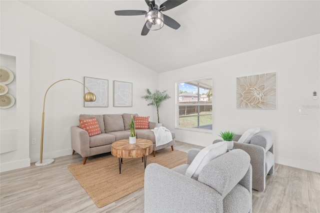 10538 Juliano Dr, Riverview, FL 33569 - living area featuring vaulted ceiling, baseboards, light wood-style floors, and ceiling fan