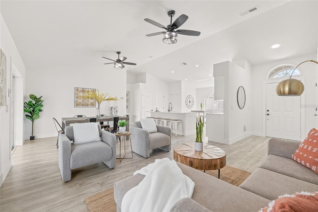 10538 Juliano Dr, Riverview, FL 33569 - living area with vaulted ceiling, light wood-type flooring, a ceiling fan, and recessed lighting