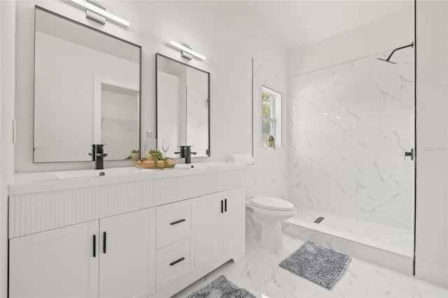 10538 Juliano Dr, Riverview, FL 33569 - bathroom with double vanity, marble look tiles, a marble finish shower, and toilet