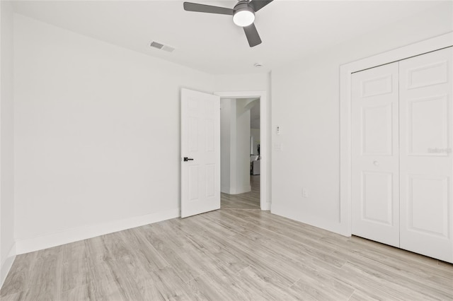 10538 Juliano Dr, Riverview, FL 33569 - unfurnished bedroom featuring light wood-style floors, a closet, a ceiling fan, and baseboards