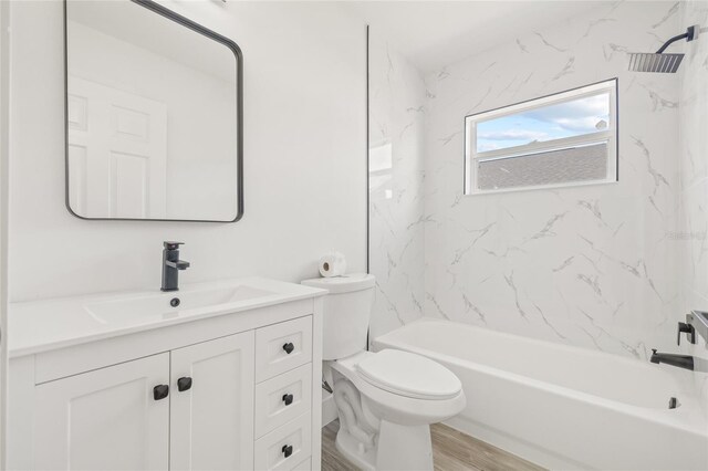 10538 Juliano Dr, Riverview, FL 33569 - bathroom with vanity, toilet, bathing tub / shower combination, and wood finished floors