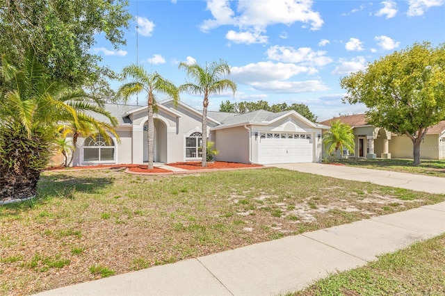 10538 Juliano Dr, Riverview, FL 33569 - view of front of house featuring an attached garage, stucco siding, driveway, and a front yard