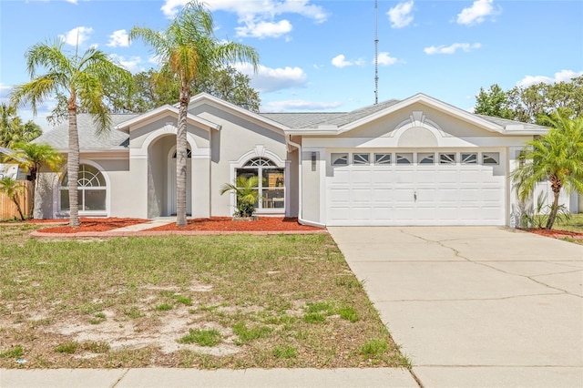 10538 Juliano Dr, Riverview, FL 33569 - ranch-style house with stucco siding, a garage, concrete driveway, and a front yard