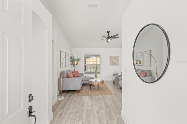 10538 Juliano Dr, Riverview, FL 33569 - living room featuring a ceiling fan, lofted ceiling, baseboards, and light wood finished floors