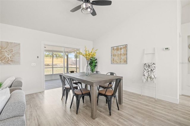 10538 Juliano Dr, Riverview, FL 33569 - dining room featuring light wood-style flooring, ceiling fan, high vaulted ceiling, and baseboards