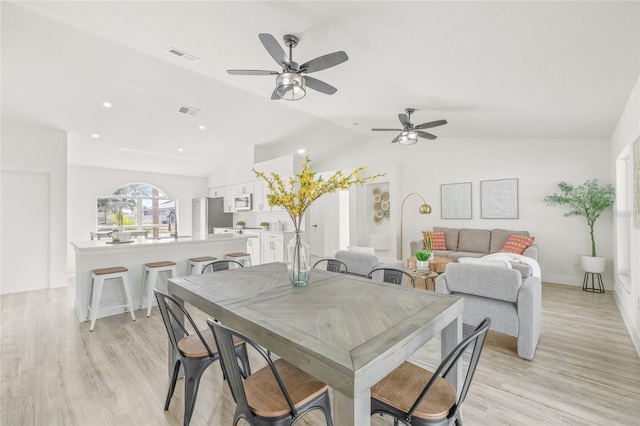 10538 Juliano Dr, Riverview, FL 33569 - dining space with vaulted ceiling, ceiling fan, and light wood-style floors