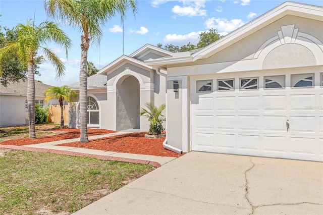 10538 Juliano Dr, Riverview, FL 33569 - ranch-style house with concrete driveway, stucco siding, and an attached garage
