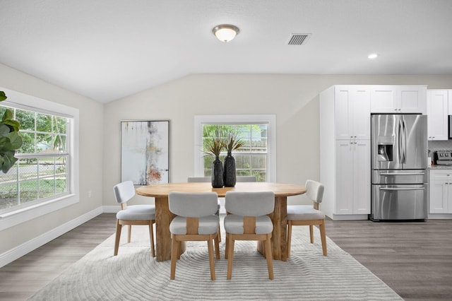 4121 W San Nicholas St, Tampa, FL 33629 - dining space with wood finished floors, lofted ceiling, baseboards, and recessed lighting