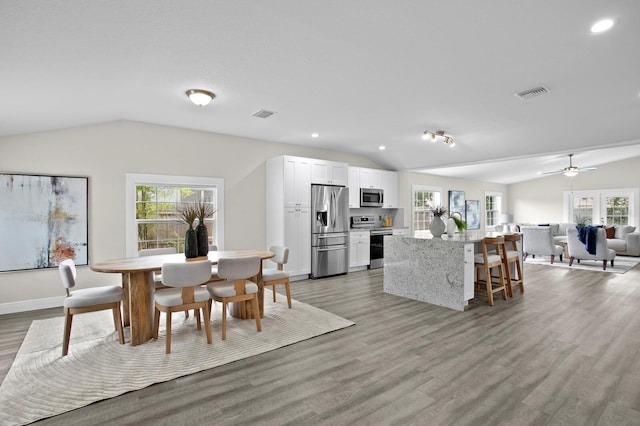 4121 W San Nicholas St, Tampa, FL 33629 - dining area with vaulted ceiling, healthy amount of natural light, light wood-style flooring, recessed lighting, and a ceiling fan