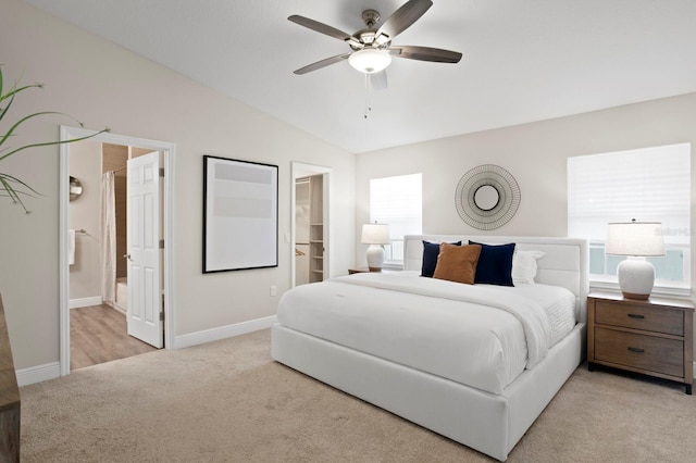 4121 W San Nicholas St, Tampa, FL 33629 - bedroom featuring light colored carpet, lofted ceiling, a spacious closet, baseboards, and connected bathroom