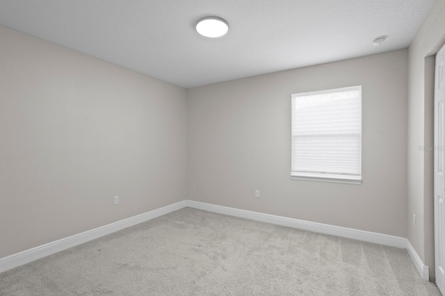 4121 W San Nicholas St, Tampa, FL 33629 - unfurnished room with light colored carpet, baseboards, and a smoke detector