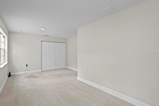 4121 W San Nicholas St, Tampa, FL 33629 - unfurnished bedroom featuring a closet, carpet flooring, and baseboards