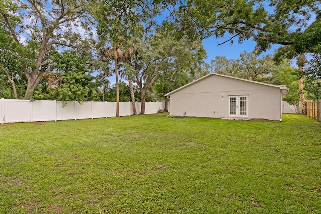 4121 W San Nicholas St, Tampa, FL 33629 - fenced backyard featuring french doors