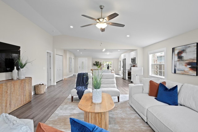 4121 W San Nicholas St, Tampa, FL 33629 - living area featuring lofted ceiling, healthy amount of natural light, light wood-type flooring, a ceiling fan, and recessed lighting