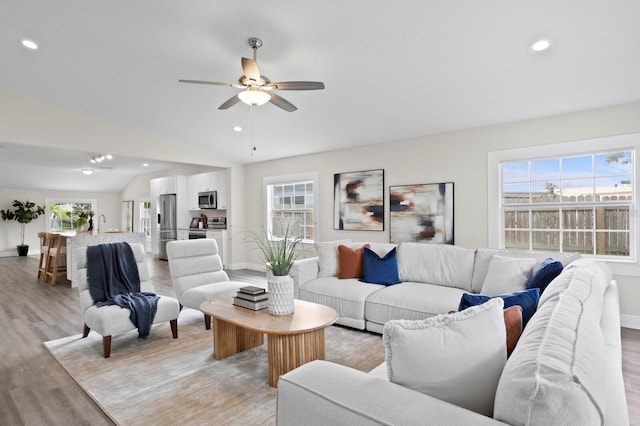 4121 W San Nicholas St, Tampa, FL 33629 - living area featuring vaulted ceiling, light wood-type flooring, plenty of natural light, recessed lighting, and a ceiling fan