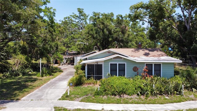 5680 77th Ave N, Pinellas Park, FL 33781 - bungalow with a chimney and a sunroom