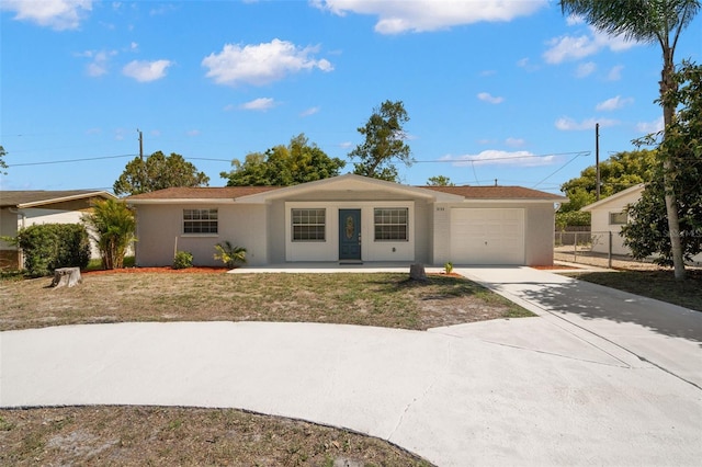 5122 Chet Dr, New Port Richey, FL 34652 - ranch-style house featuring a garage, concrete driveway, stucco siding, and a porch